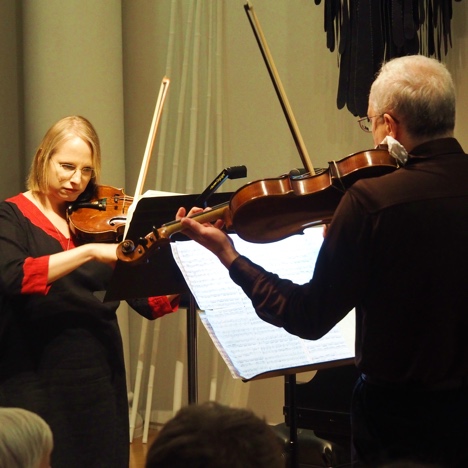 Photo of a violinist and violist from the GVO performing a duo