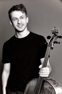 Black and white portrait of cellist Ari Evan