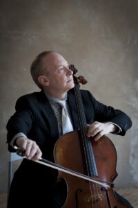 Portrait photograph of cellist Samuel Magill